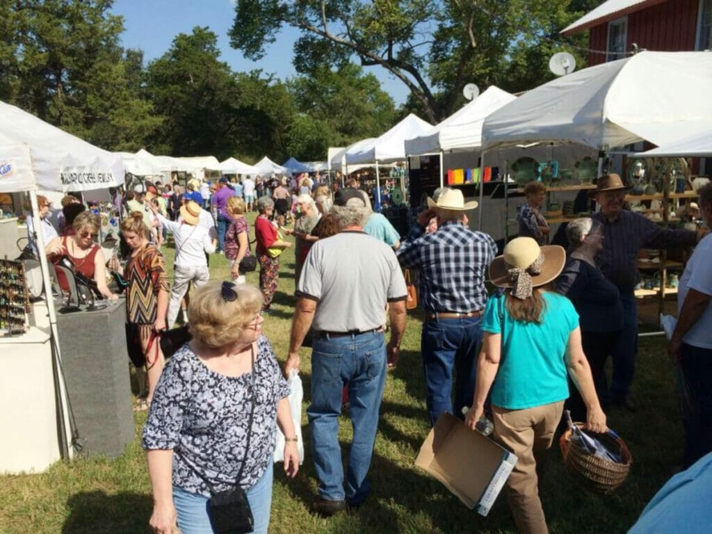 People walking around the Edom Art Festival in Edom, Texas