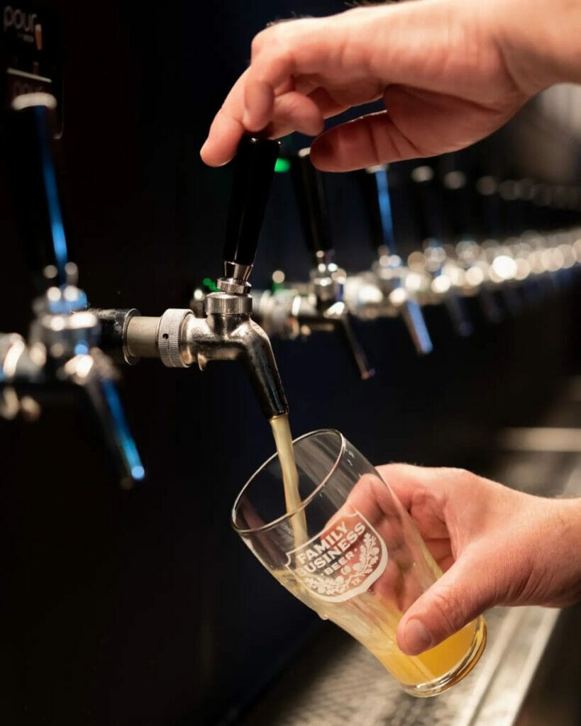 Pouring beer at the Family Business Beer 