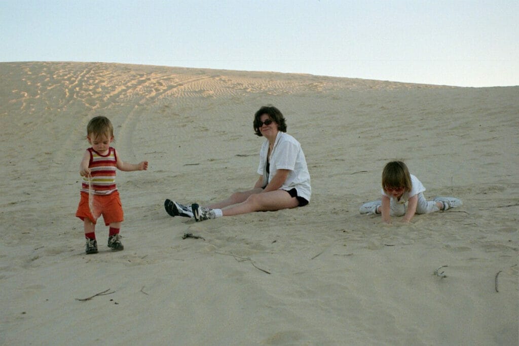 An image of a family playing in the sand at Monahans Sandhill State Park
