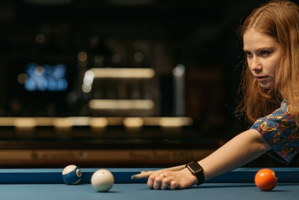 Girl playing pool