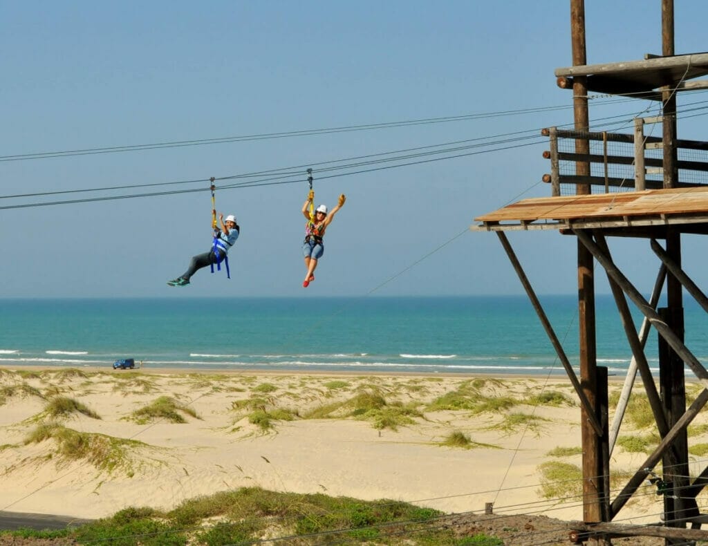 Women ziplining at SPI Adventure Park