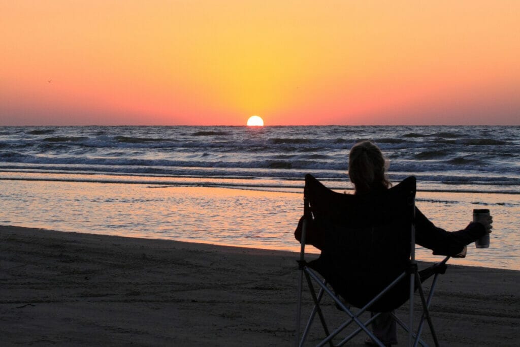 Image of a woman enjoying the sunset 