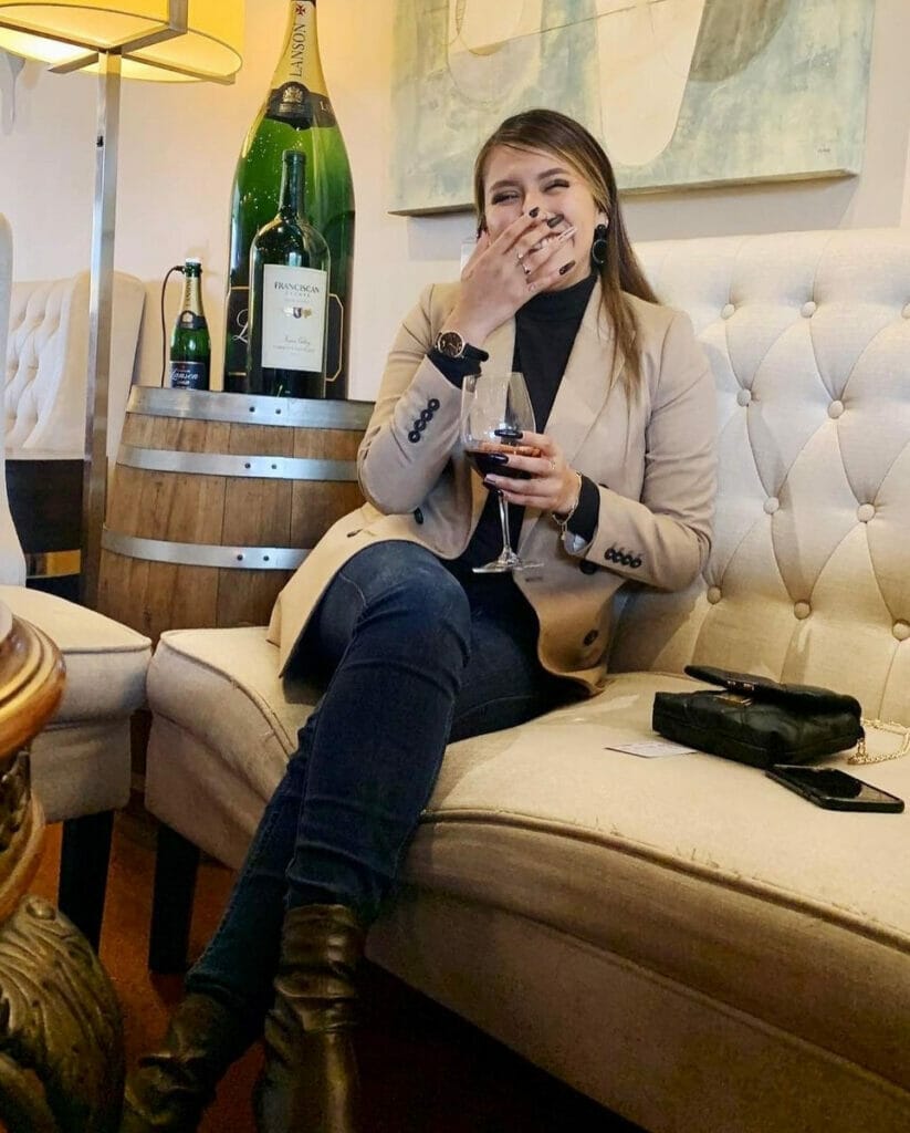Girl drinking wine at the Wanderlust Wine Co.