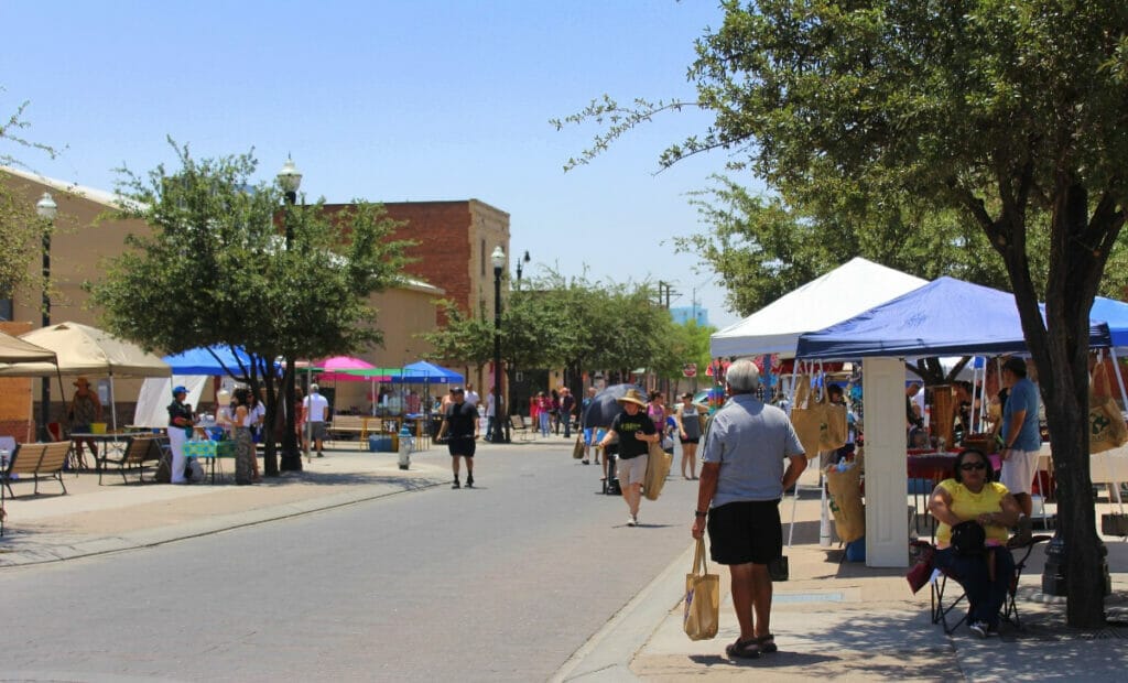 People walking around the El Paso Farmers Market 