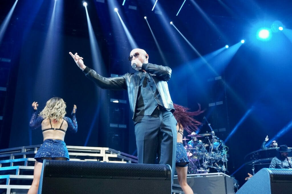 Pitbull performing at Sames Auto Arena 