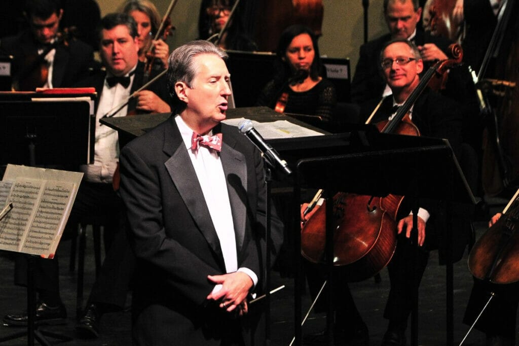 Man singing at the symphony 