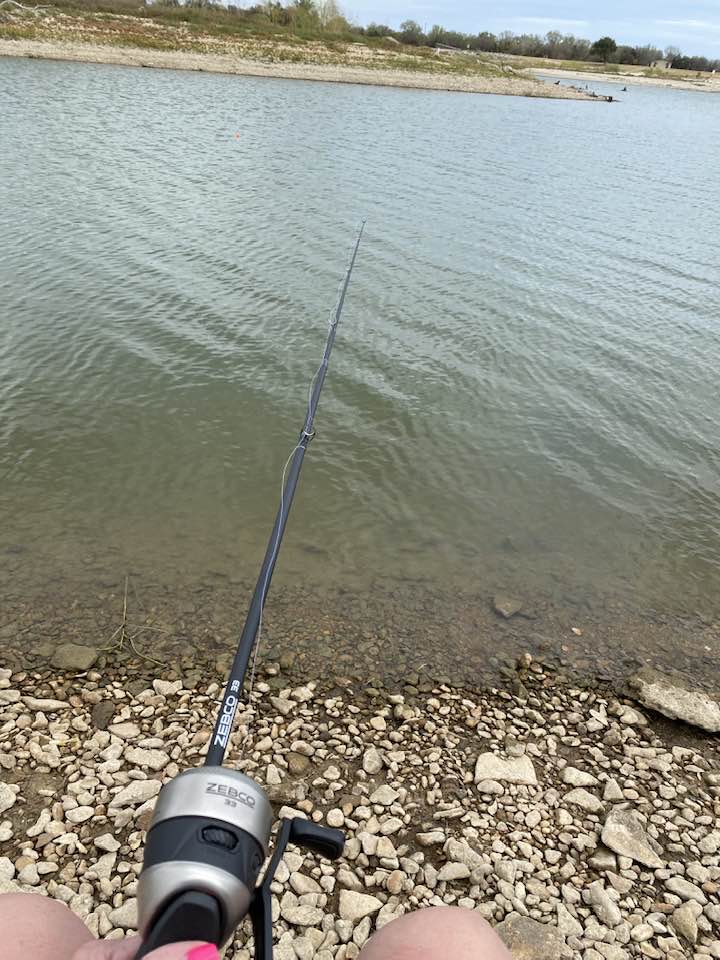 Woman fishing at Airport Park 