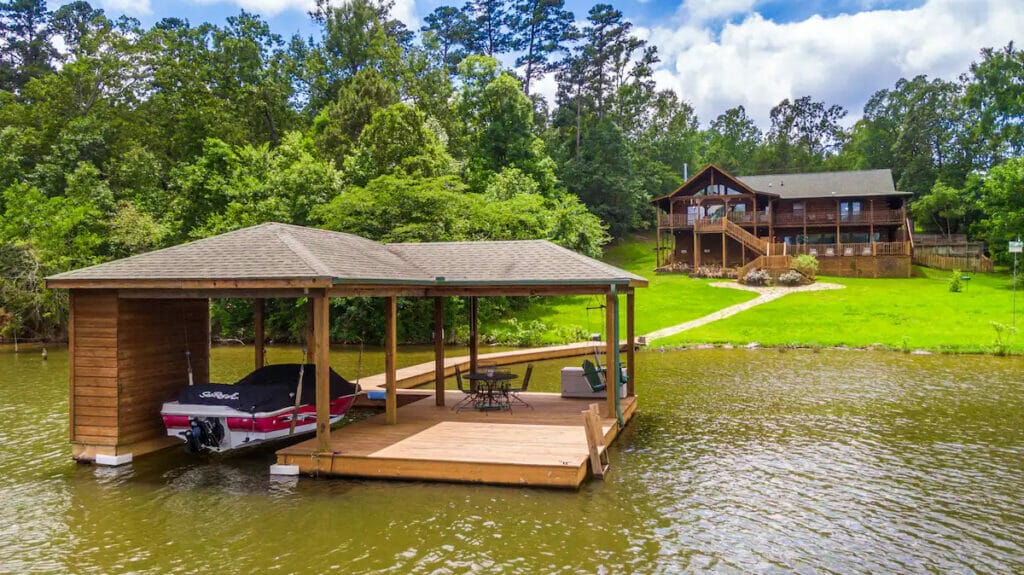 View of the Lakeside house from the water with the boat 