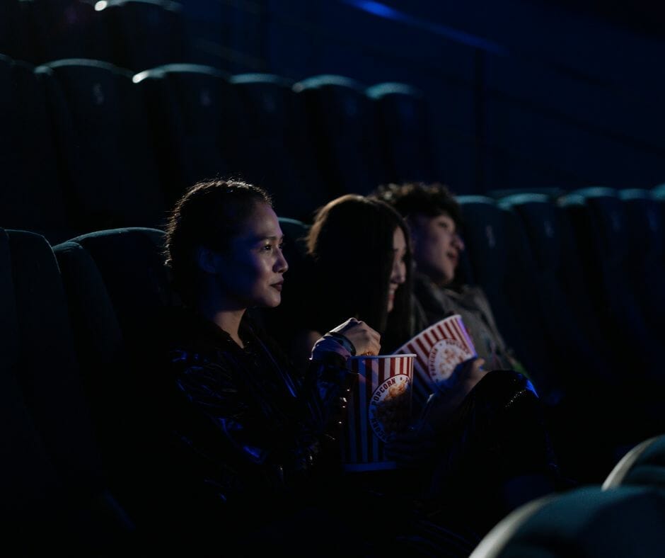 Girls sitting in movie theater