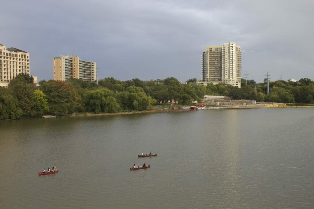 People kayaking through a river through Austin 