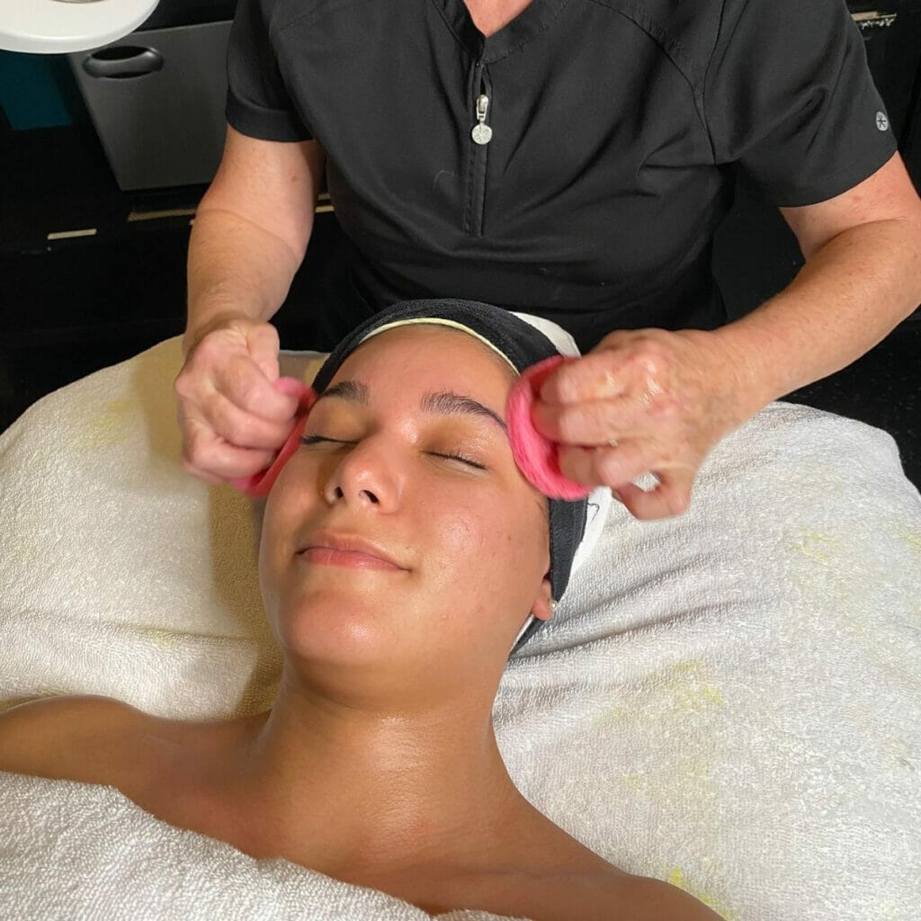 Woman getting a facial at the Sanctuary Spa 