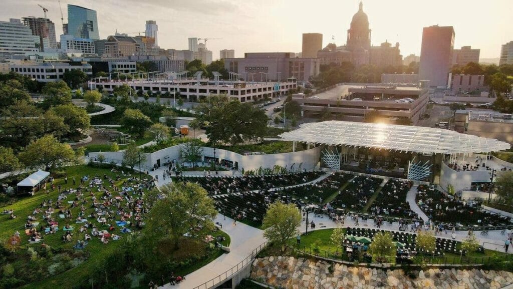 People sitting outside at Waterloo Park in Austin