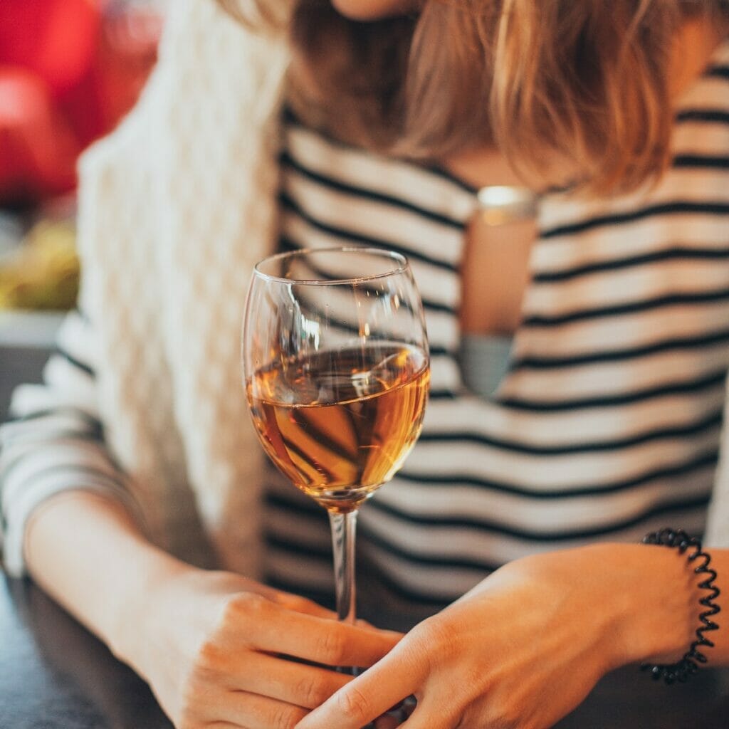 Girl drinking a glass of wine 
