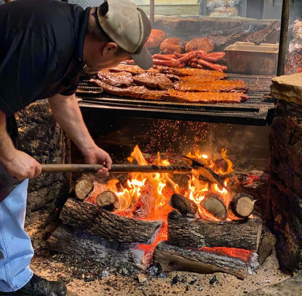 Man working at Salt Lick bbq 