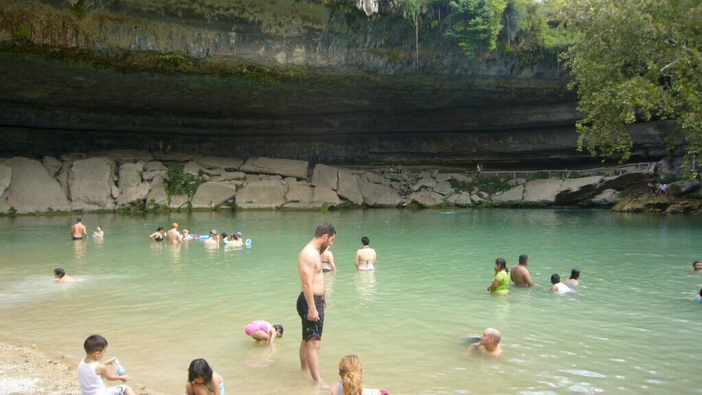 People swimming in the Hamilton Pool 