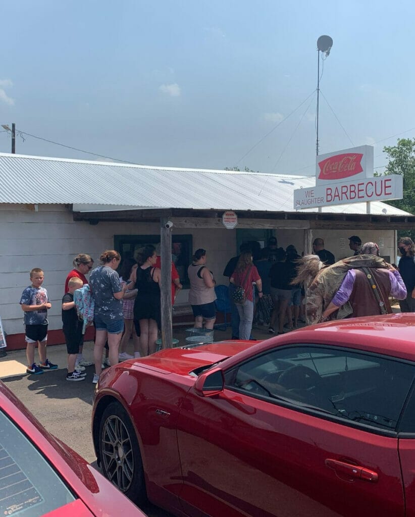 People lined up outside of the Gas Station